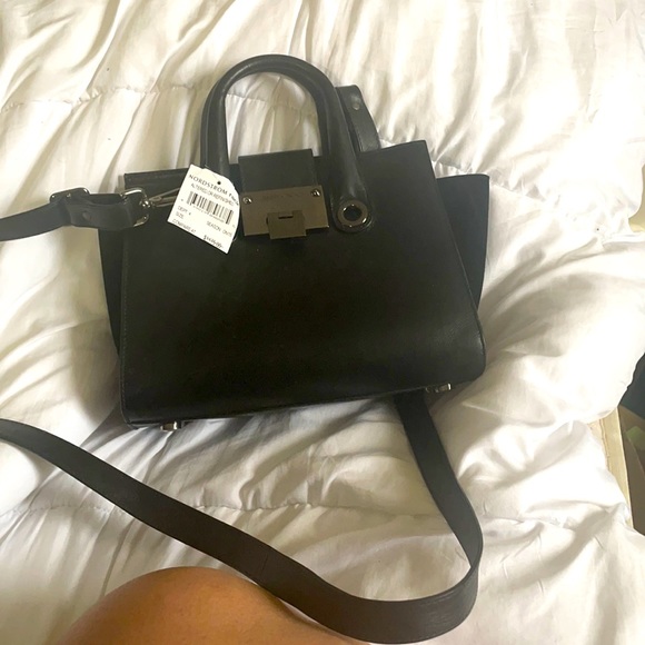 Jimmy Choo Handbags - Almost new w tag  from Nordstrom rack but says refurbished Jimmy choo bag